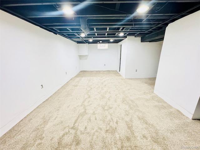 19165 Roger St, Melvindale, MI 48122 - below grade area featuring carpet and baseboards