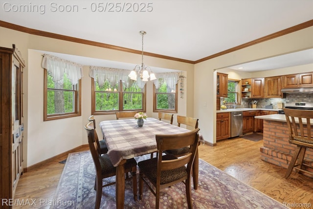 4121 Marsh Trl, Milford, MI 48380 - dining area with baseboards, a chandelier, crown molding, and light wood-style floors