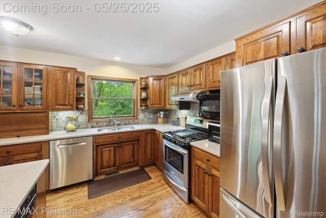 4121 Marsh Trl, Milford, MI 48380 - kitchen with appliances with stainless steel finishes, a sink, open shelves, brown cabinetry, and recessed lighting