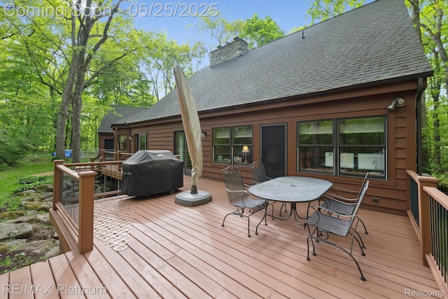 4121 Marsh Trl, Milford, MI 48380 - wooden terrace with a grill and outdoor dining area