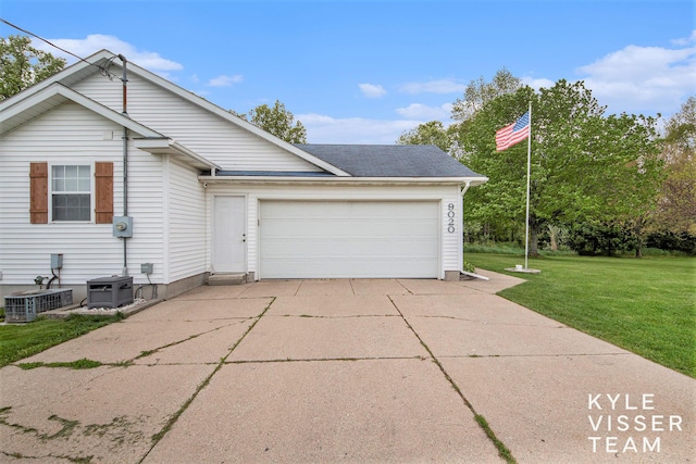 9020 5 Mile Rd NE, Ada, MI 49301 - view of front of house with a front yard, an attached garage, concrete driveway, and central AC