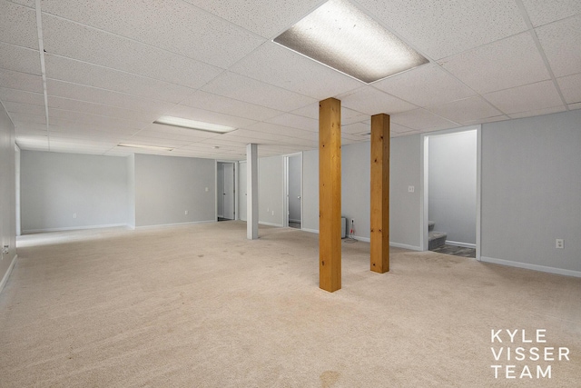9020 5 Mile Rd NE, Ada, MI 49301 - finished basement with stairway, a paneled ceiling, baseboards, and carpet