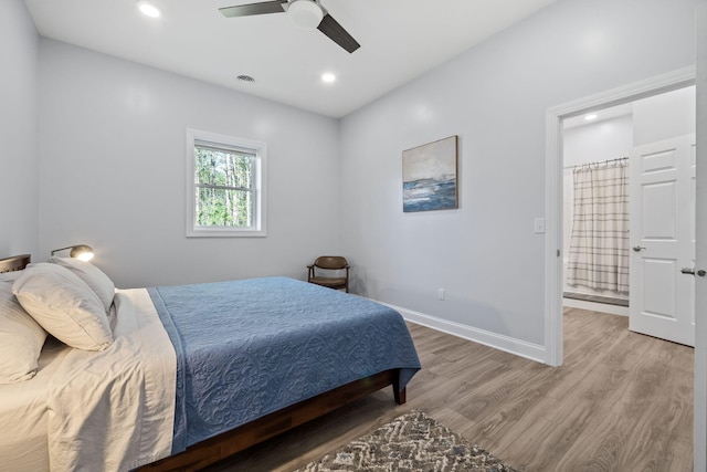 4624 Parman Rd, Stockbridge, MI 49285 - bedroom with light wood-type flooring, recessed lighting, baseboards, ceiling fan, and connected bathroom