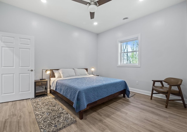 4624 Parman Rd, Stockbridge, MI 49285 - bedroom with baseboards, light wood-type flooring, ceiling fan, and recessed lighting