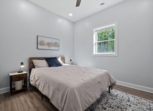 4624 Parman Rd, Stockbridge, MI 49285 - bedroom featuring baseboards, wood finished floors, and a ceiling fan
