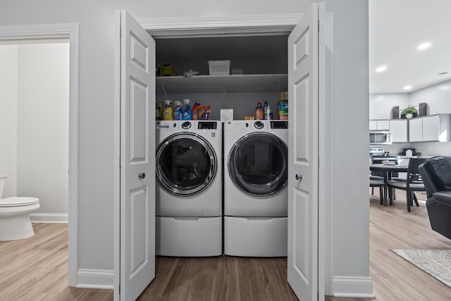 4624 Parman Rd, Stockbridge, MI 49285 - washroom featuring washer and dryer, light wood-style flooring, baseboards, and recessed lighting