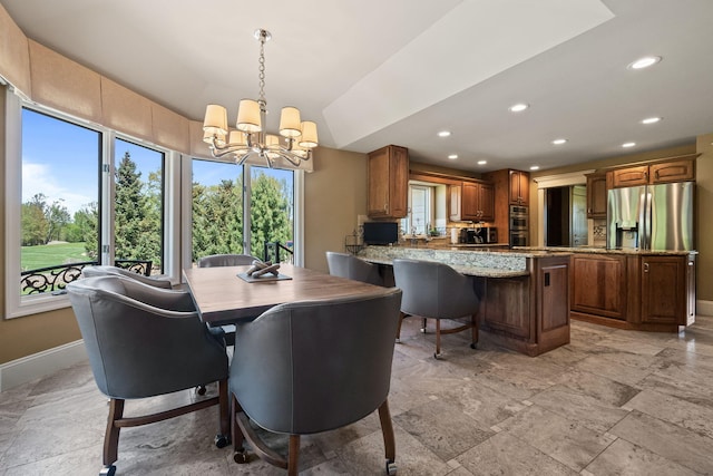4624 Parman Rd, Stockbridge, MI 49285 - dining area featuring a chandelier, baseboards, recessed lighting, and light stone finish flooring