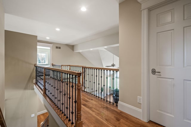4624 Parman Rd, Stockbridge, MI 49285 - corridor featuring wood finished floors, recessed lighting, baseboards, and an upstairs landing