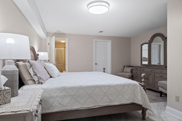4624 Parman Rd, Stockbridge, MI 49285 - bedroom featuring light marble finish flooring, connected bathroom, and baseboards