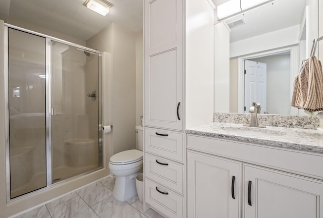 4624 Parman Rd, Stockbridge, MI 49285 - bathroom with toilet, a stall shower, marble look tile flooring, and vanity