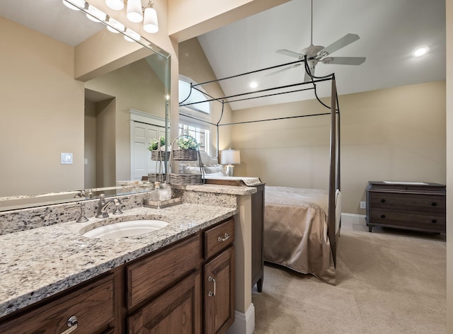 4624 Parman Rd, Stockbridge, MI 49285 - bathroom featuring vaulted ceiling, ceiling fan, vanity, and ensuite bathroom