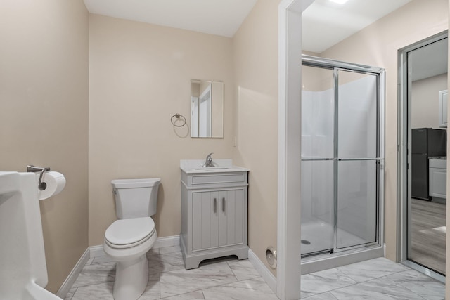 4624 Parman Rd, Stockbridge, MI 49285 - bathroom featuring marble finish flooring, a shower stall, baseboards, toilet, and vanity