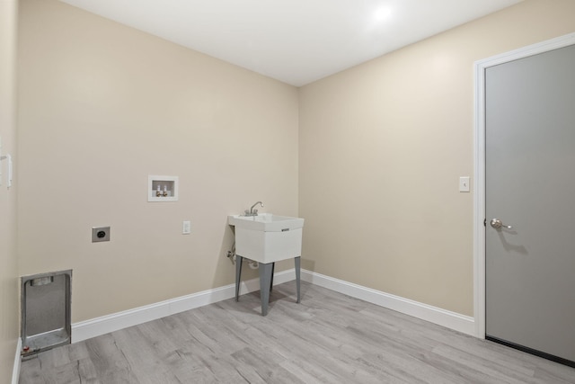 4624 Parman Rd, Stockbridge, MI 49285 - washroom featuring electric dryer hookup, light wood-style flooring, hookup for a washing machine, and baseboards