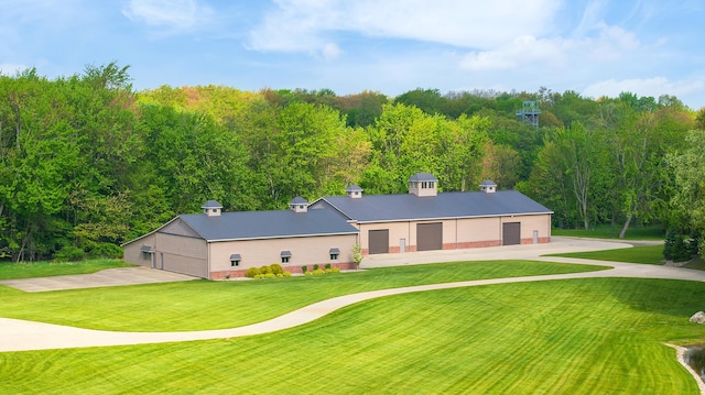 4624 Parman Rd, Stockbridge, MI 49285 - view of front of property with a front yard and a detached garage