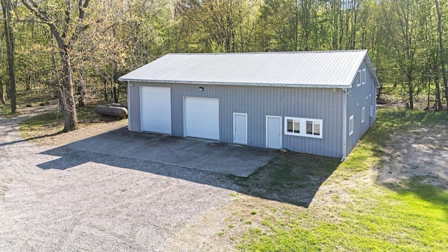 4624 Parman Rd, Stockbridge, MI 49285 - detached garage featuring a wooded view