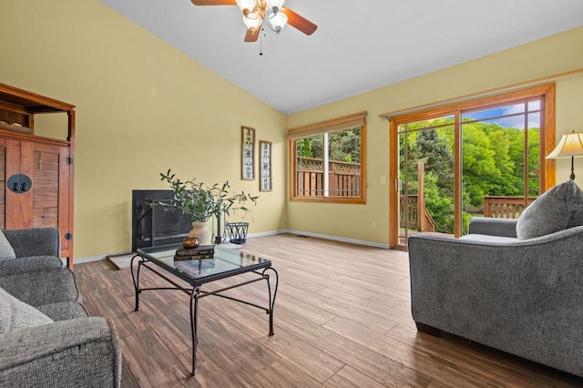 4900 Grass Lake Rd, White Lake, MI 48383 - living room featuring ceiling fan, wood finished floors, baseboards, and high vaulted ceiling