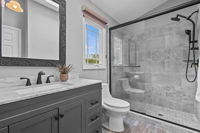 4900 Grass Lake Rd, White Lake, MI 48383 - full bathroom with a shower stall, toilet, vanity, wood finished floors, and lofted ceiling