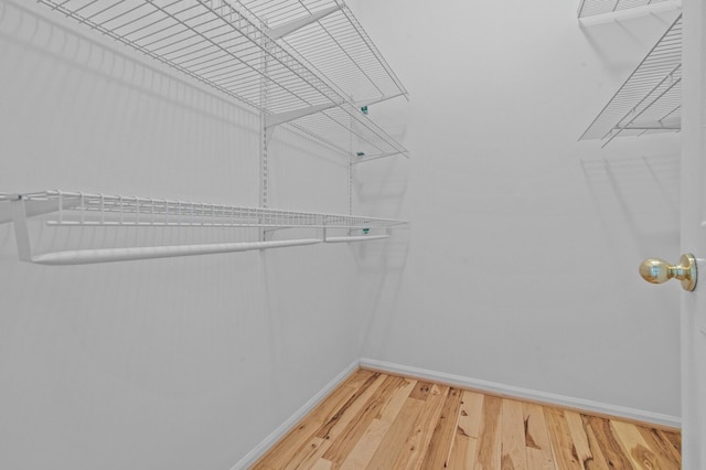 4900 Grass Lake Rd, White Lake, MI 48383 - spacious closet featuring wood finished floors