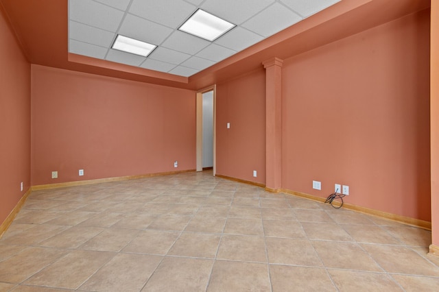 4900 Grass Lake Rd, White Lake, MI 48383 - empty room featuring light tile patterned flooring and a paneled ceiling