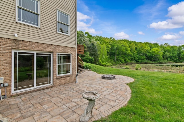 4900 Grass Lake Rd, White Lake, MI 48383 - view of patio with a fire pit, stairway, and a view of trees