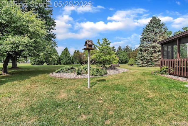 2232 Hayward St, Clio, MI 48420 - view of green lawn featuring a sunroom