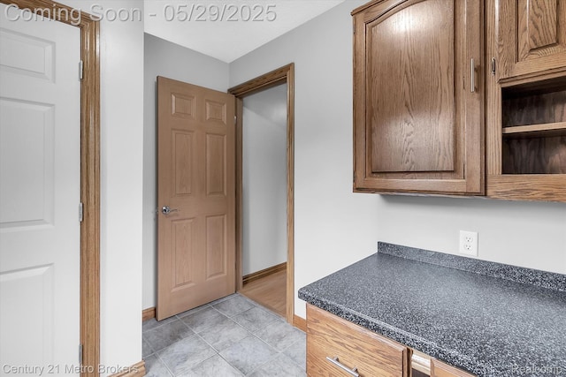2232 Hayward St, Clio, MI 48420 - kitchen featuring dark countertops and baseboards