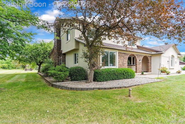 2232 Hayward St, Clio, MI 48420 - view of front of home with a front lawn and stucco siding