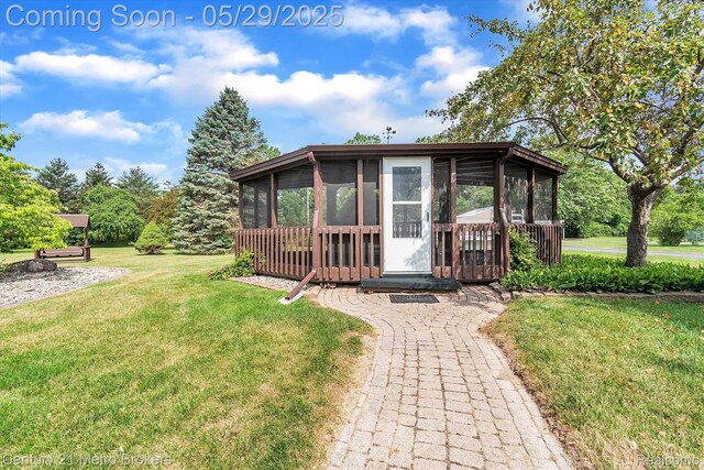 2232 Hayward St, Clio, MI 48420 - view of outdoor structure featuring a sunroom