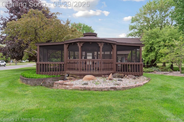 2232 Hayward St, Clio, MI 48420 - back of house with a sunroom, a yard, and a chimney