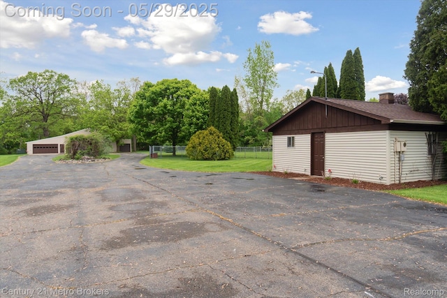 2232 Hayward St, Clio, MI 48420 - detached garage with view of wooded area