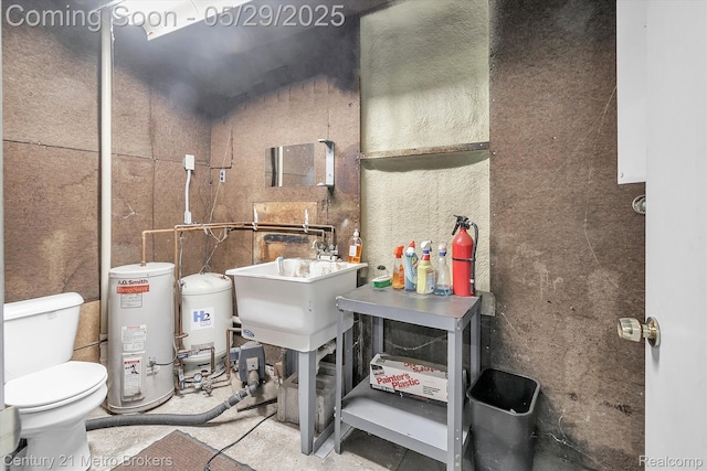 2232 Hayward St, Clio, MI 48420 - bathroom with gas water heater, toilet, and a sink