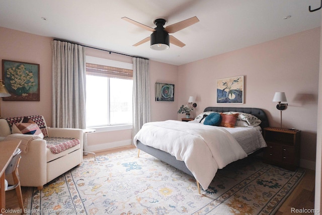 8401 Kennedy Cir N Unit 7, Warren, MI 48093 - bedroom with light wood-type flooring and ceiling fan