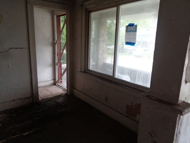 14876 Wisconsin St, Detroit, MI 48238 - unfurnished room featuring healthy amount of natural light and wood finished floors