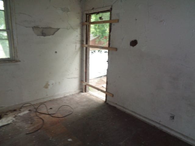 14876 Wisconsin St, Detroit, MI 48238 - empty room with healthy amount of natural light