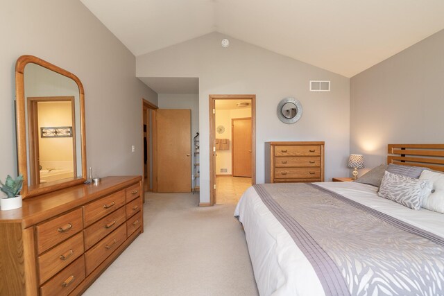 7130 Riesling St, Michigan, MI 49071 - bedroom with vaulted ceiling, light carpet, and ensuite bath