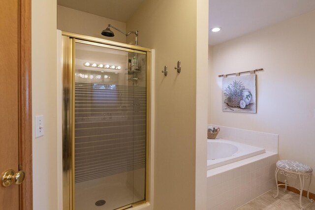 7130 Riesling St, Michigan, MI 49071 - bathroom featuring a stall shower, a garden tub, and tile patterned floors