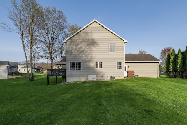 7130 Riesling St, Michigan, MI 49071 - rear view of house featuring a wooden deck, a yard, and central AC unit