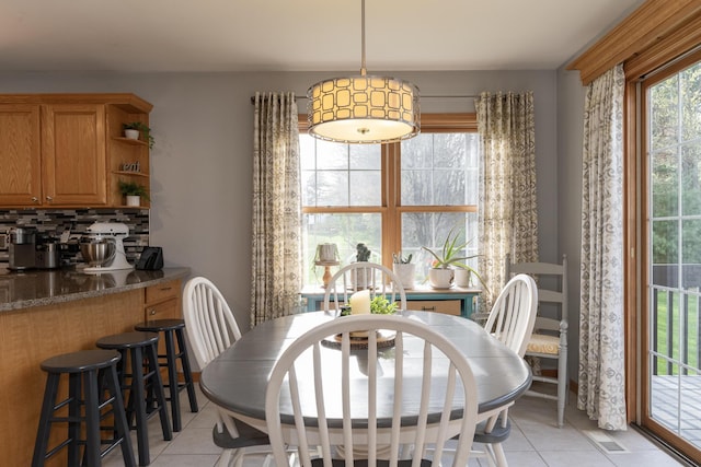 7130 Riesling St, Michigan, MI 49071 - dining area featuring light tile patterned floors