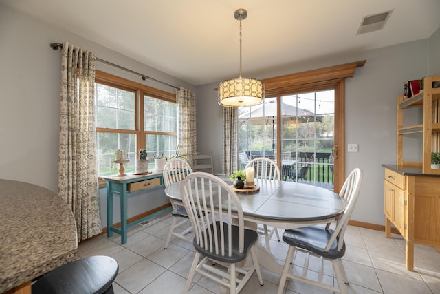7130 Riesling St, Michigan, MI 49071 - dining space with plenty of natural light, light tile patterned flooring, and baseboards