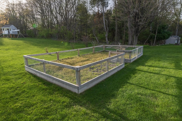 7130 Riesling St, Michigan, MI 49071 - view of green lawn featuring a garden
