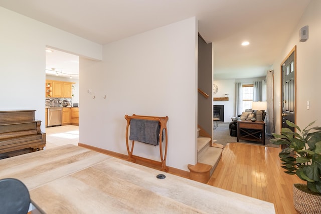 7130 Riesling St, Michigan, MI 49071 - living room featuring stairs, light wood-style floors, recessed lighting, and baseboards