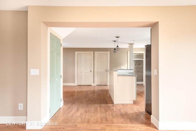 3320 N Sturgeon Rd, Midland, MI 48642 - hall featuring light wood-style flooring and baseboards