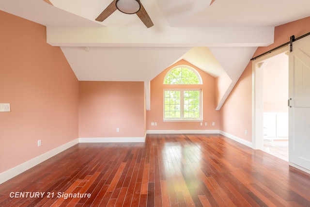 3320 N Sturgeon Rd, Midland, MI 48642 - additional living space featuring a barn door, a ceiling fan, wood-type flooring, and baseboards