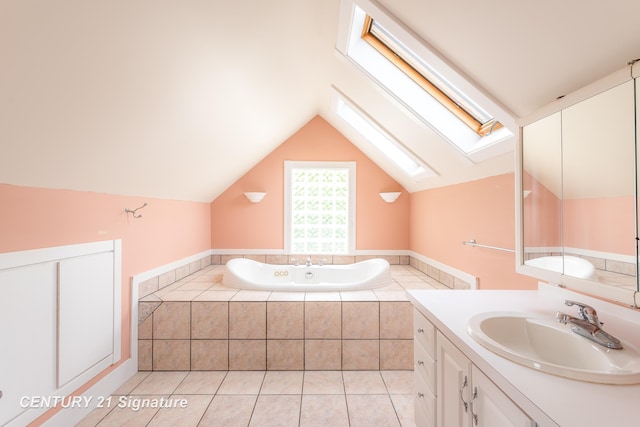 3320 N Sturgeon Rd, Midland, MI 48642 - bathroom featuring a skylight, a bath, vanity, vaulted ceiling, and tile patterned floors