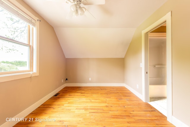3320 N Sturgeon Rd, Midland, MI 48642 - bonus room featuring light wood-style flooring, ceiling fan, lofted ceiling, and baseboards