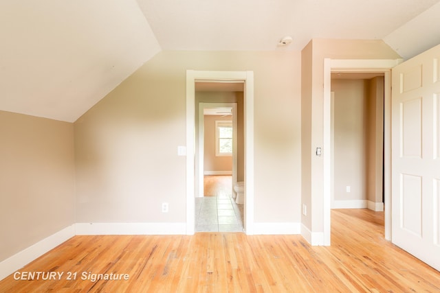 3320 N Sturgeon Rd, Midland, MI 48642 - additional living space with light wood-style flooring, lofted ceiling, and baseboards