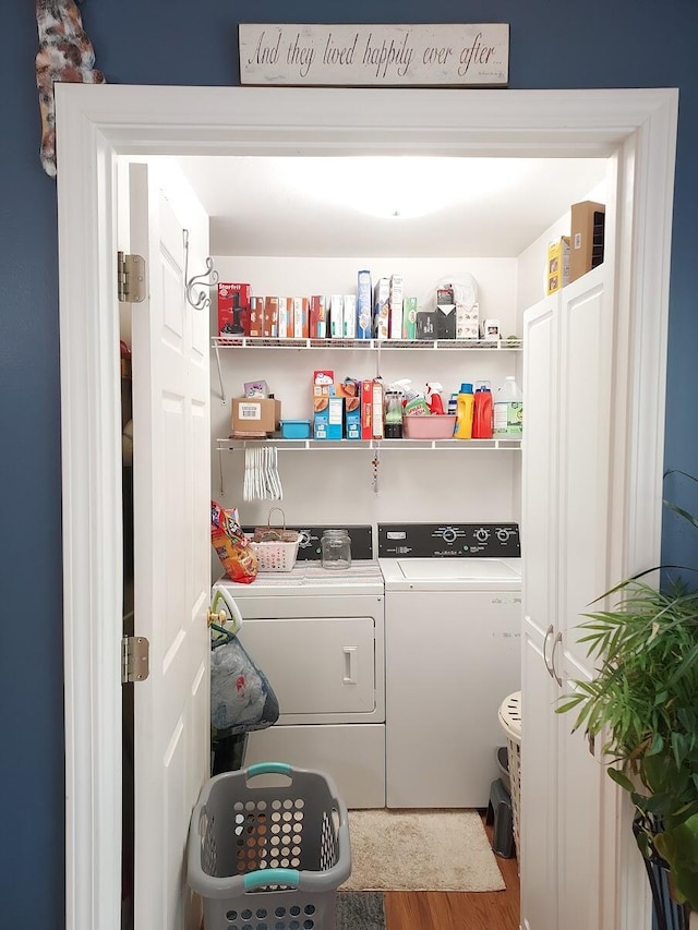 1946 Catherine Ave, Muskegon, MI 49442 - washroom featuring washing machine and dryer and wood finished floors