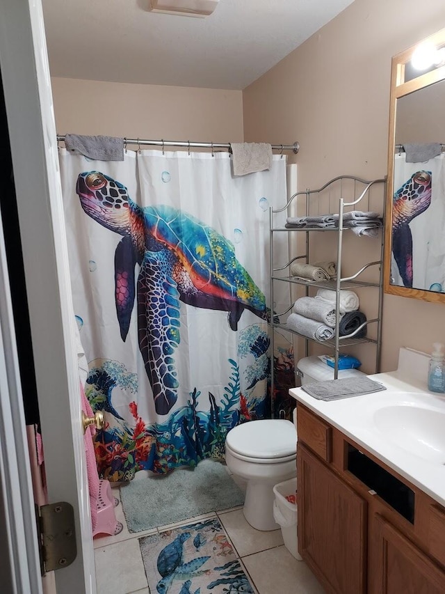 1946 Catherine Ave, Muskegon, MI 49442 - full bathroom featuring tile patterned flooring, toilet, vanity, and a shower with curtain