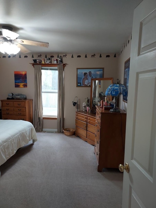 1946 Catherine Ave, Muskegon, MI 49442 - bedroom featuring light colored carpet and a ceiling fan