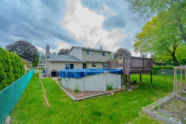 32904 Surow Dr, Warren, MI 48093 - rear view of house with a deck and brick siding